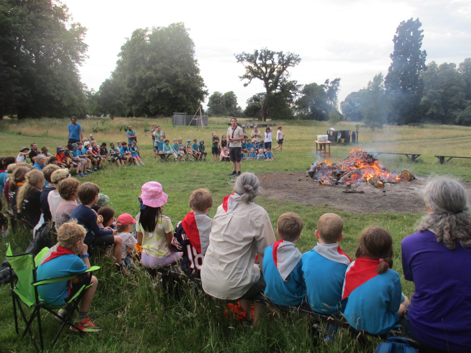 Scouts gathered round a campfire